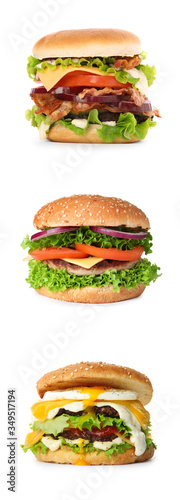 Set of different delicious burgers on white background