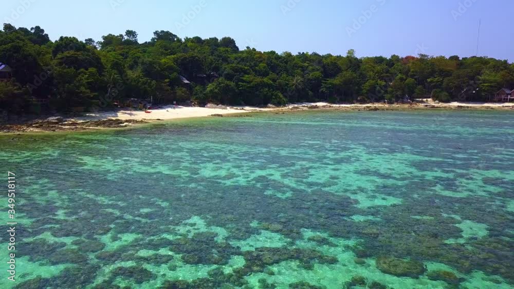 Aerial view, Summer colorful seascape with tropical island. Beautiful paradise sea with island. Calm andaman sea at Koh Lipe, Satun, Thailand. The daisy cutter shot. Aerial view, Summer colorful seascape with tropical island. Beautiful paradise sea with island. Calm andaman sea at Koh Lipe, Satun, Thailand. The daisy cutter shot.