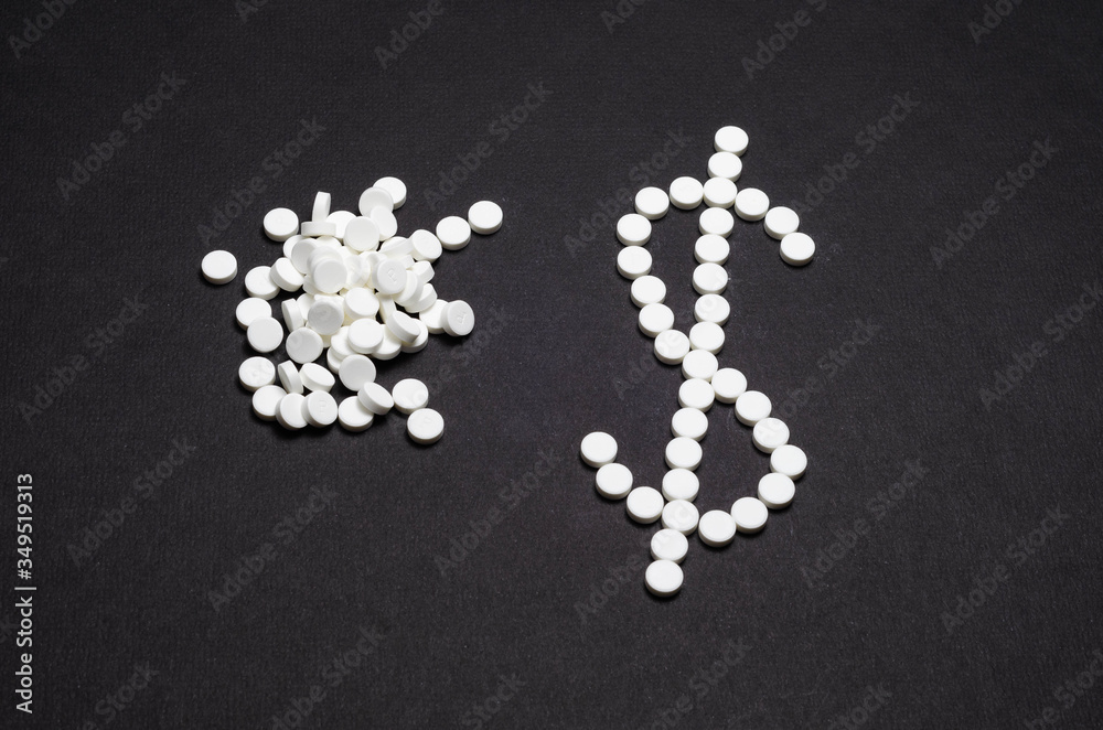 money sign. lined with tablets money sign. lined with tablets