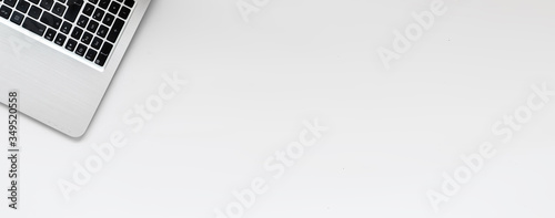 Flat lay banner of laptop, top view with copy space. Business workspace