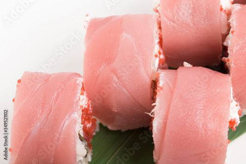Tuna sushi maki with eel and white cheese.