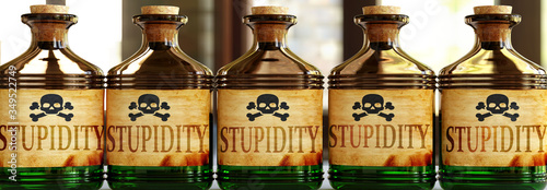 Stupidity can be like a deadly poison - pictured as word Stupidity on toxic bottles to symbolize that Stupidity can be unhealthy for body and mind, 3d illustration photo