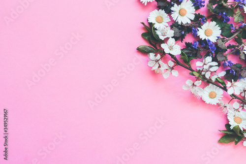 Copy space with flowers on pink background.