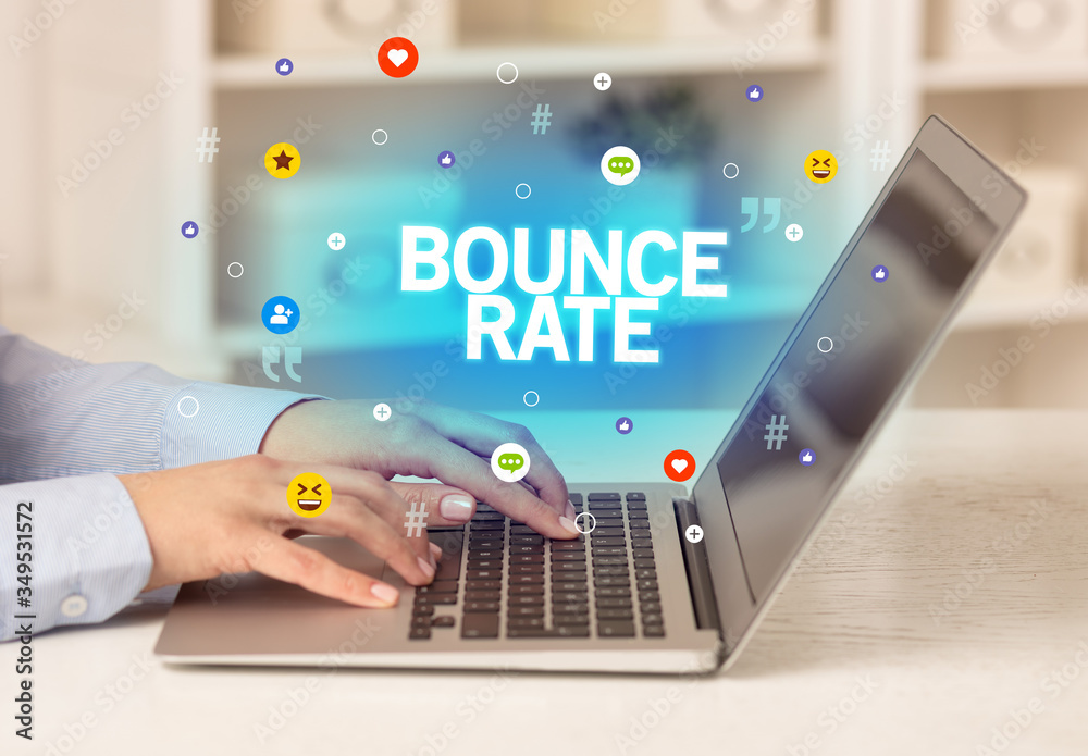 Freelance woman using laptop with BOUNCE RATE inscription, Social media concept Freelance woman using laptop with BOUNCE RATE inscription, Social media concept