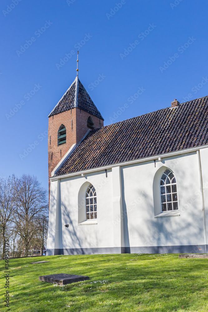 Little white church in historic village Mensingeweer, Netherlands