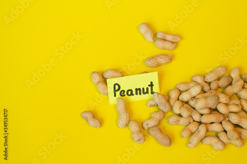 Peanuts pattern isolated on a yellow backround. Repetition concept.