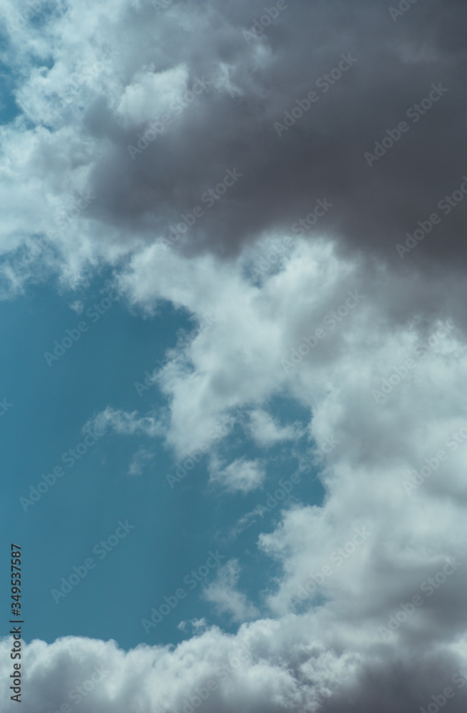 Fluffy clouds cover the summer blue sky Fluffy clouds cover the summer blue sky