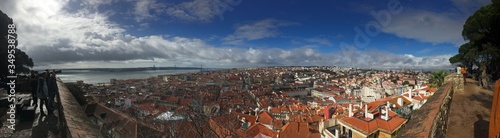 Panoramic view from Castelo de S. Jorge in Lisbon. Sunny day, clear blue sky with some clouds.
