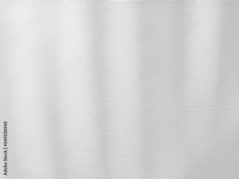 abstract shadow of palm leaves on white concrete wall abstract shadow of palm leaves on white concrete wall