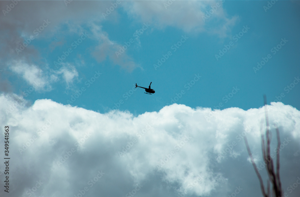 Fototapeta premium Fluffy clouds cover the summer blue sky