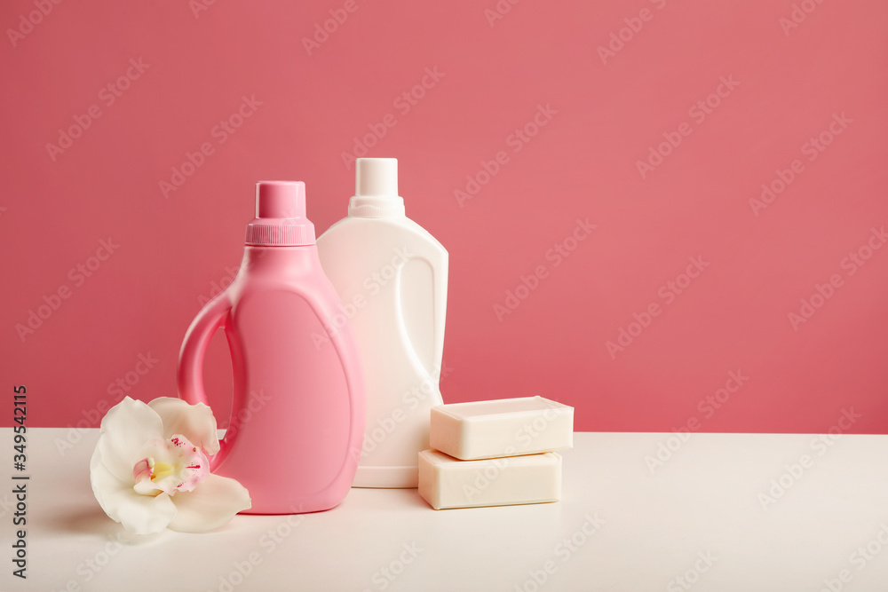 Detergents, soap and orchid flower on pink background. Detergents, soap and orchid flower on pink background.