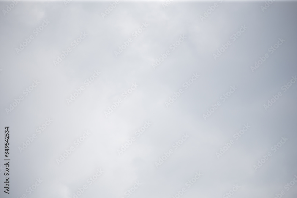 Obraz premium Fluffy clouds cover the summer blue sky