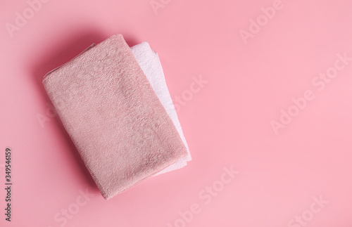Bath towelson pink background