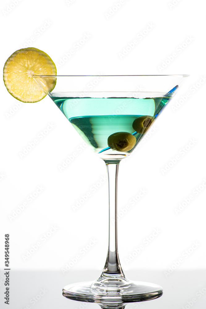 cocktail with martini, olives and lime wedge cocktail with martini, olives and lime wedge