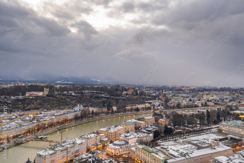 Aerial drone view of Monchsberg and mirabelle park by Salzach river in snowy winter in Salzburg Austria Aerial drone view of Monchsberg and mirabelle park by Salzach river in snowy winter in Salzburg Austria