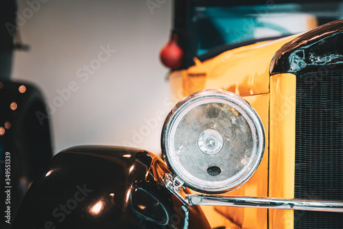 Close Headlamp Of Yellow Retro Vintage Oldtimer Car photo