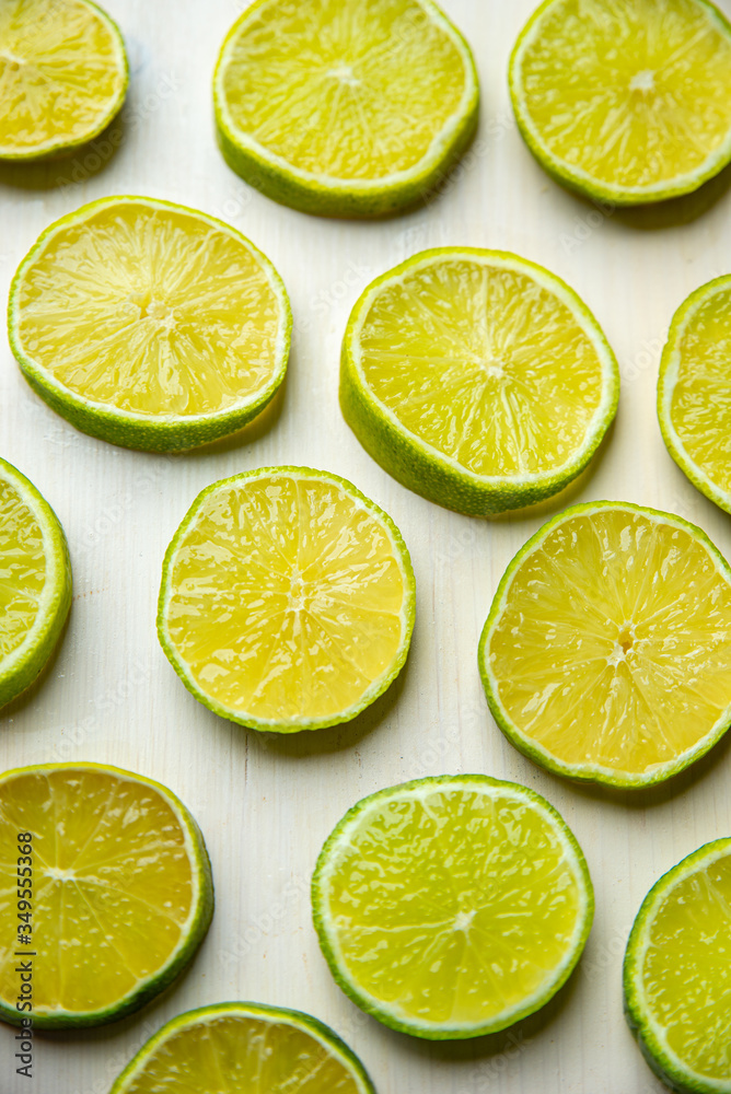Lime slices on a wooden surface