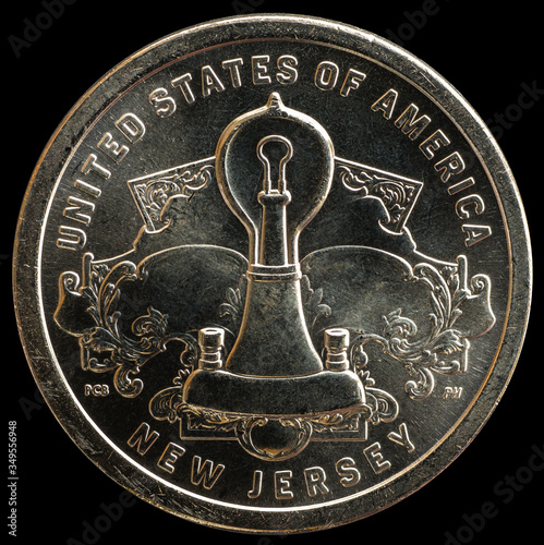 1 dollar coin. American innovation. Incandescent lamp thomas edison photo