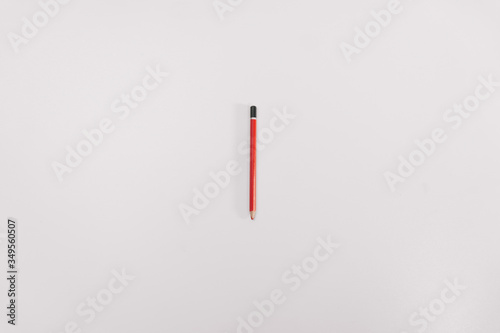 Red construction pencil on a white background isolation. Copy space on top. Construction Tools Sale Concept photo