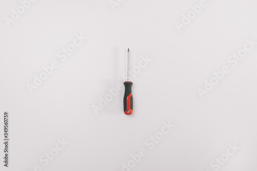 Screwdriver on a white background isolation. Copy space on top. Construction Tools Sale Concept photo