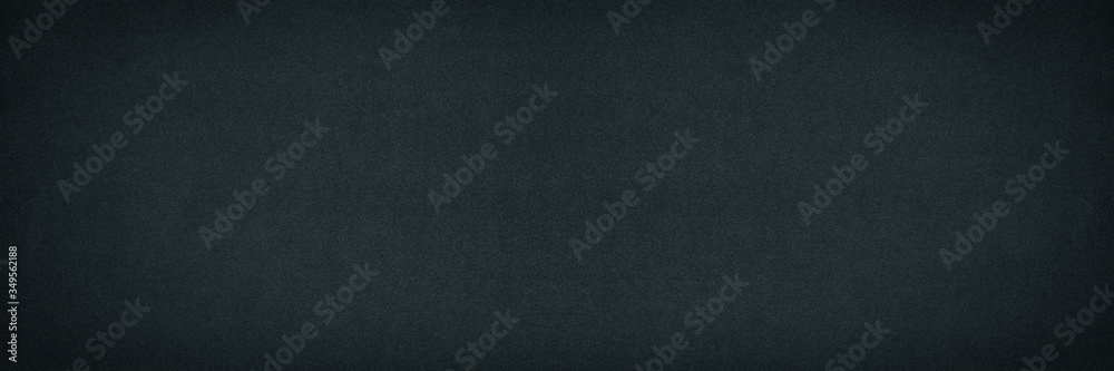 Black fine textured paper surface widescreen background. Dark wide texture