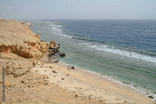 Beautiful azure red sea with waves and rocks and clear blue sky in Egypt