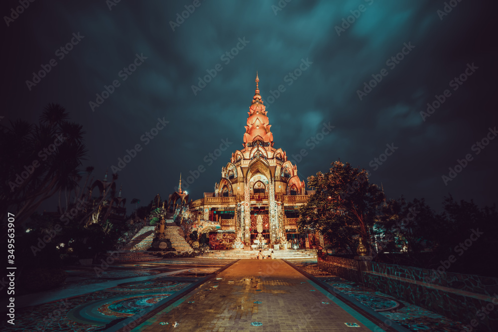Amazing Thailand Temple Wat Phra Thart Pha Sorn Kaew in Asia with big Buddha statue on background scenery dramatic cloudy sky at sunset. Beautiful Landmark of Asia.