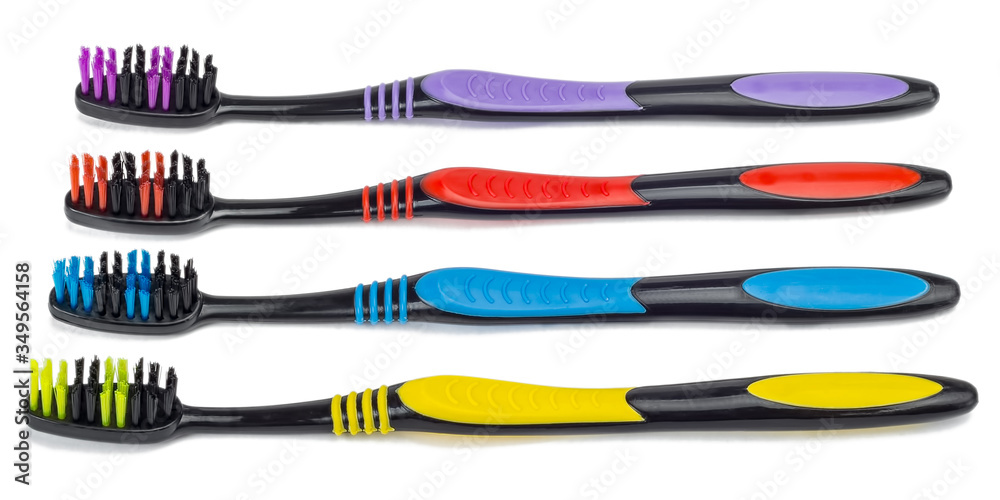 Black toothbrushes with colored trim isolated on a white background.