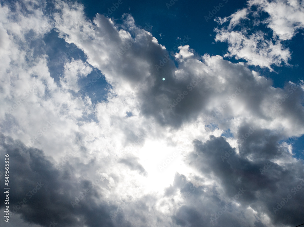 Obraz premium The background of sun rays over clouds. The sun rays break over the clouds.