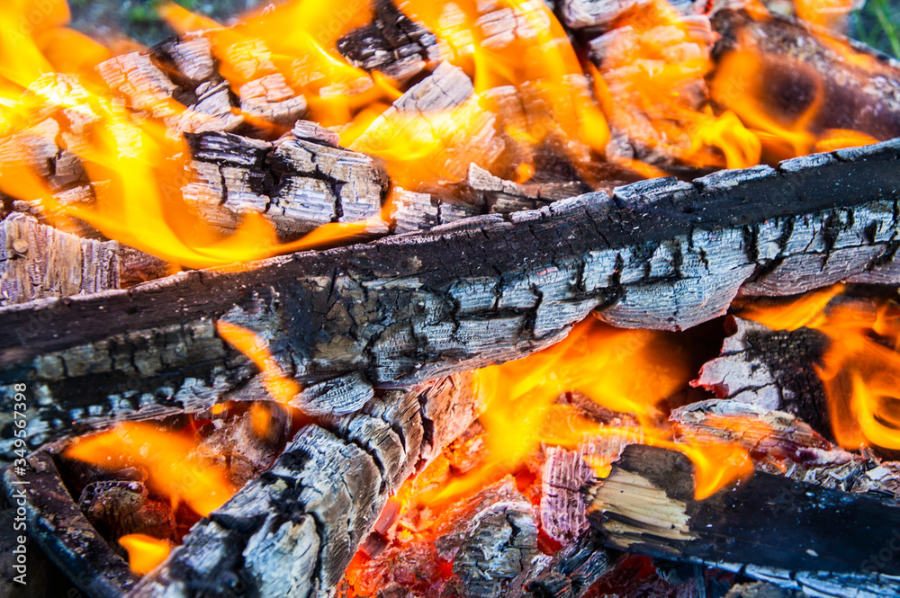 Burning firewood coals close-up