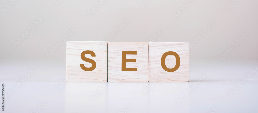 SEO (Search Engine Optimization) text wooden cube blocks on table background. Idea, Vision, Strategy, Analysis, Keyword and Content concept SEO (Search Engine Optimization) text wooden cube blocks on table background. Idea, Vision, Strategy, Analysis, Keyword and Content concept