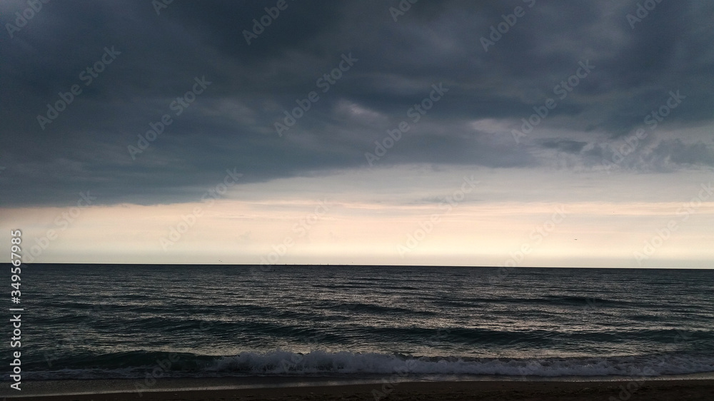 Dark clouds and light over sea