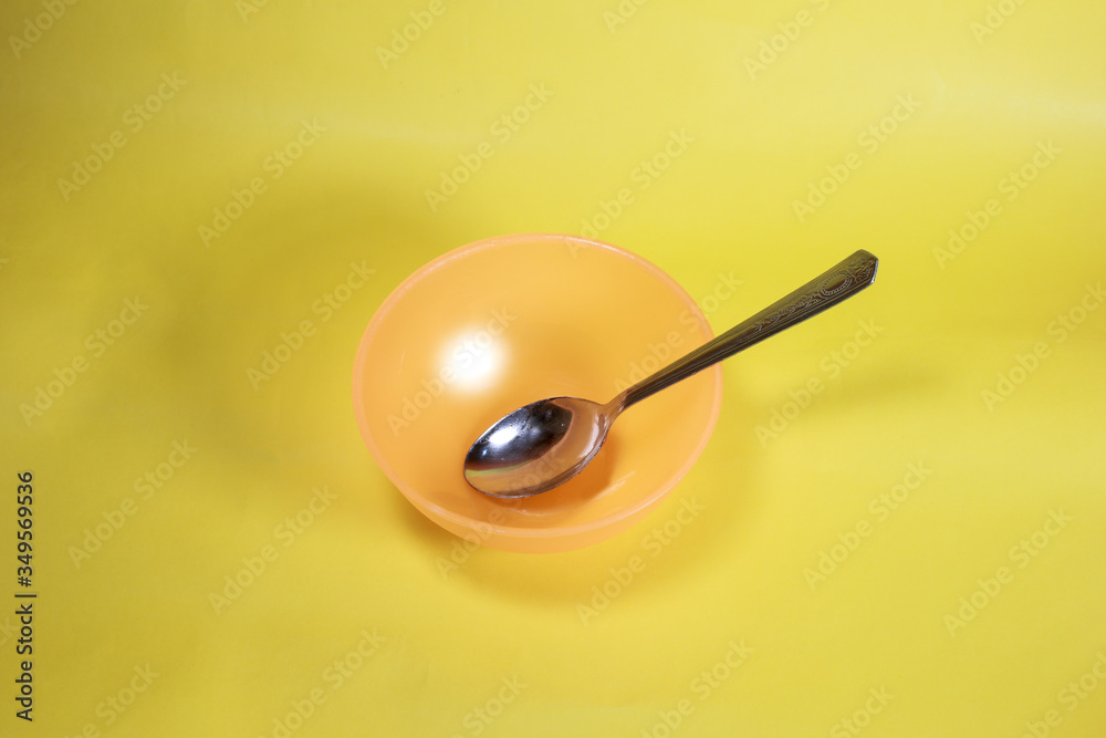 Plastic bowl with spoon, The process of cooking, Kitchen composition Plastic bowl with spoon, The process of cooking, Kitchen composition