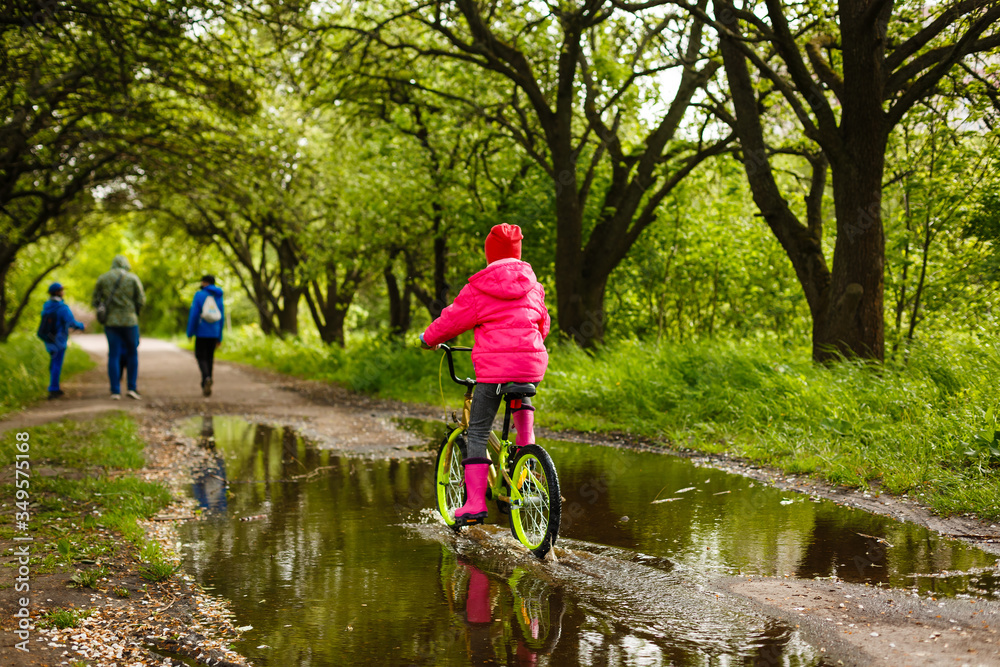 Happy little girl with her bicycle Happy little girl with her bicycle