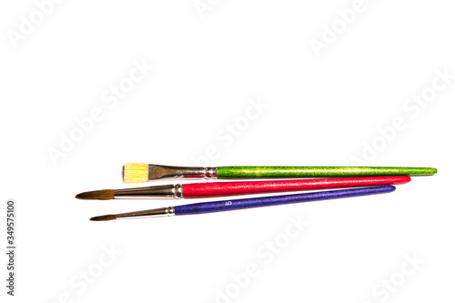 Colorful different wooden Paintbrushes isolated on white 