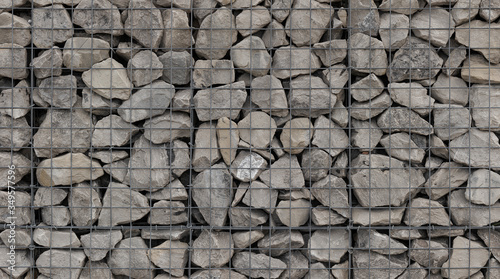 caged stone garden wall, gabion baskets filled with rocks