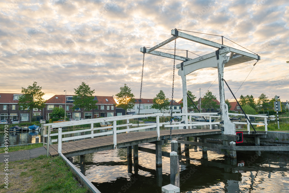 Traditional dutch drawbridge in the village of Reeuwijk-dorp, close to Gouda, Netherlands Traditional dutch drawbridge in the village of Reeuwijk-dorp, close to Gouda, Netherlands