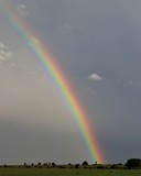 A Beautiful Rainbow Against A Clouded Sky In South Central Oklahoma