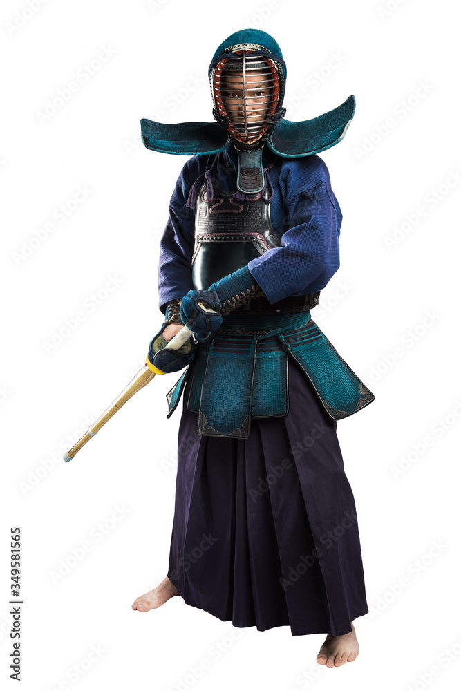 Fototapeta premium Portrait of man kendo fighter with shinai (bamboo sword). Shot in studio. Isolated with clipping path on white background