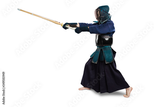 Portrait of man kendo fighter with shinai (bamboo sword). Shot in studio. Isolated with clipping path on white background