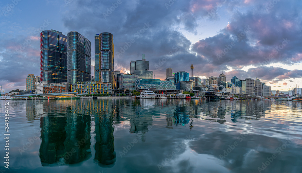 Sydney downtown skyline at Darling Harbor bay, business and recreational arcade, in Sydney, NSW, Australia at sunrise
