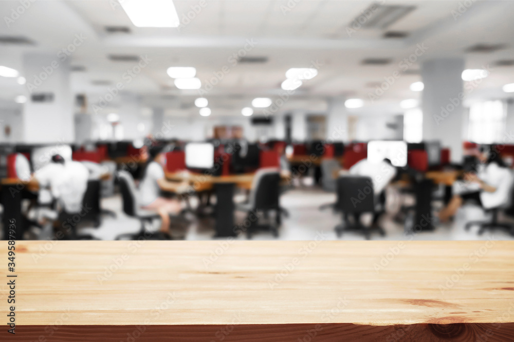 Empty wooden desk space over blurred office or meeting room background. Product display montage. Empty wooden desk space over blurred office or meeting room background. Product display montage.