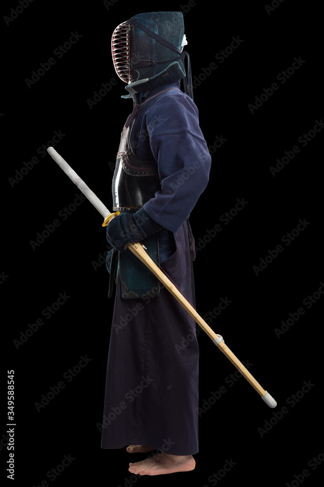 Portrait of man kendo fighter with shinai (bamboo sword). Shot in studio. Isolated with clipping path on black background Portrait of man kendo fighter with shinai (bamboo sword). Shot in studio. Isolated with clipping path on black background