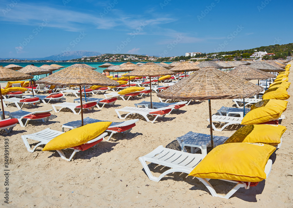 Empty beach chairs on the beach near blue water, Kemer, Turkey, Empty beach chairs on the beach near blue water, Kemer, Turkey,