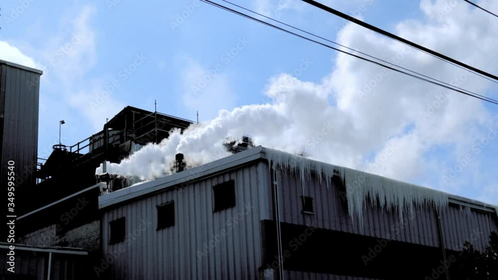 Factory with steam from Chimney in Winter Factory with steam from Chimney in Winter