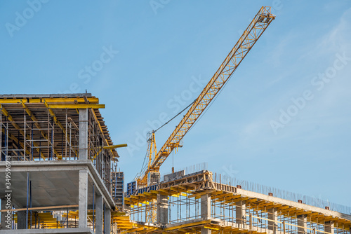 Photos Construction crane near new built house