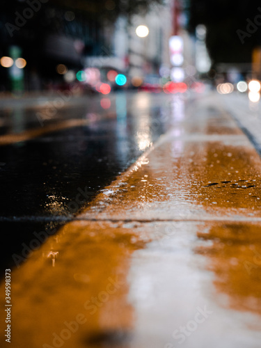 Bokeh and details of rainy day city concrete ground