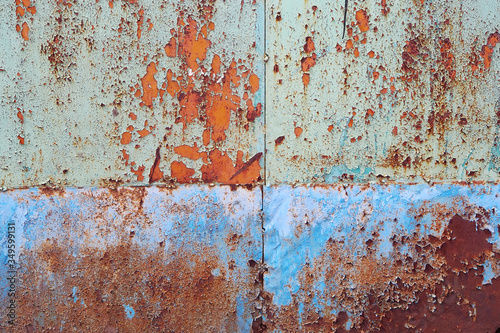 rusty metal surface with traces of peeling paint