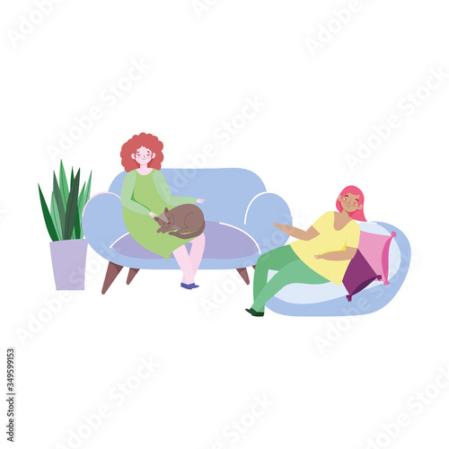 young women sitting in living room with cat and cushions window