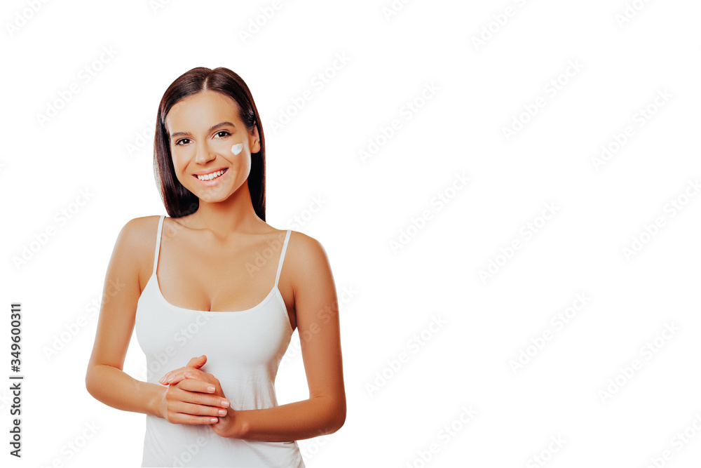 Beautiful Young Woman Over White Background. Beauty Portrait. Anti aging, Skincare, Beauty Treatment. restorative cream or lotion for the face, Healthcare and anti-aging cosmetics Beautiful Young Woman Over White Background. Beauty Portrait. Anti aging, Skincare, Beauty Treatment. restorative cream or lotion for the face, Healthcare and anti-aging cosmetics